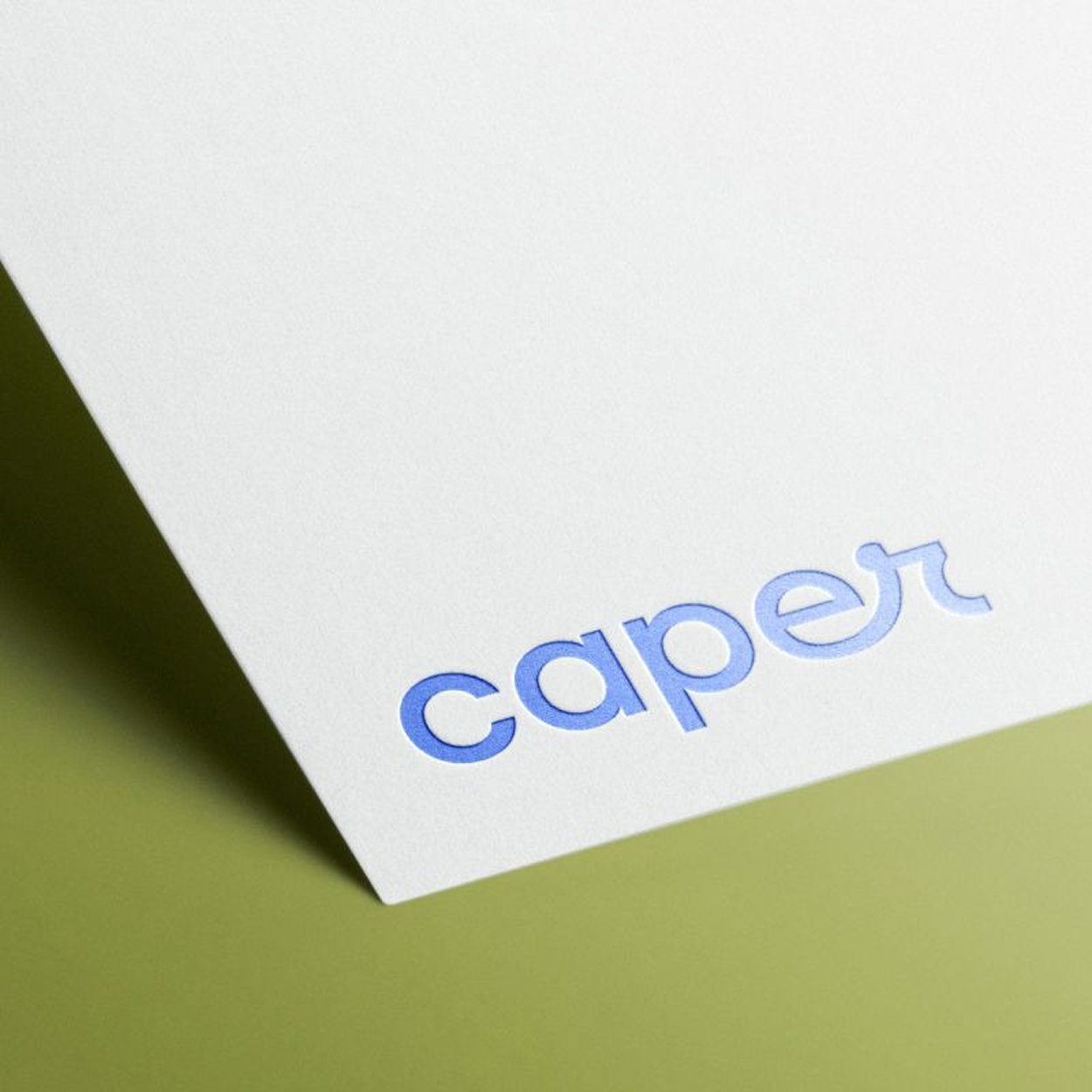 Caper custom brand identity design — letterhead with Moss accents