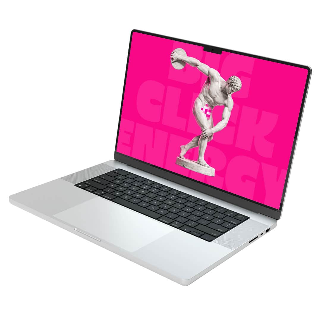 web design services: laptop with bright pink screen and a greek statue throwing a discus